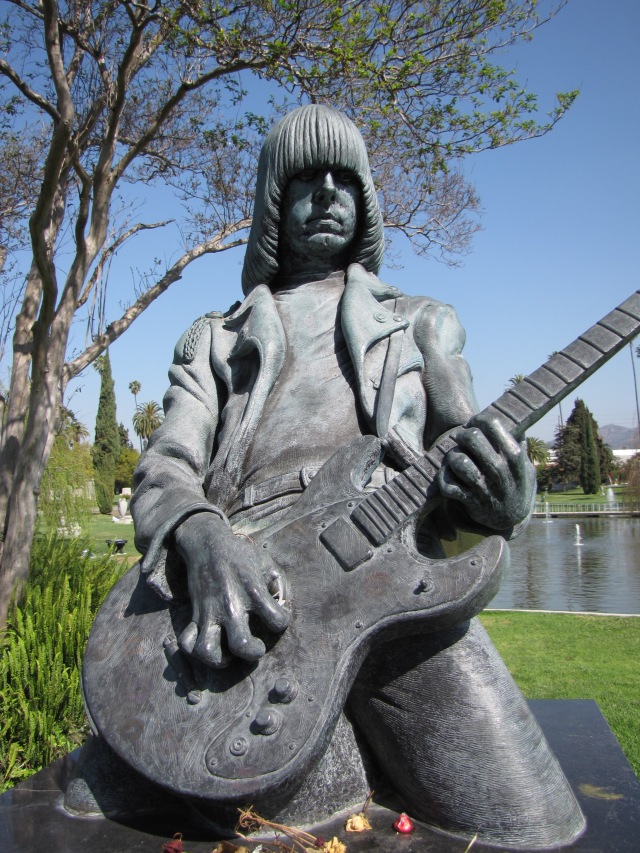 The sculpture of Johnny Ramones on top of his memorial in the Hollywood Memorial Park.
